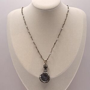 Elegant Beaded Necklace with Silver Stamp Pendant